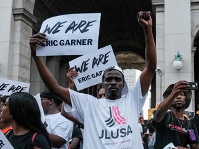 Protesters march and rally on the fifth anniversary of the death of Eric Garner, a day after federal prosecutors announced their decision not to prosecute NYPD officer Daniel Pantaleo, in New York, July 17, 2019. (REUTERS/Michael A. McCoy)