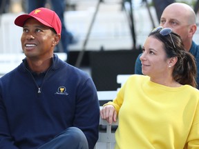 Tiger Woods and his girlfriend Erica Herman look on during a Presidents Cup media opportunity at the Yarra Promenade on Dec. 5, 2018 in Melbourne, Australia. (Scott Barbour/Getty Images)