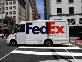 A FedEx delivery truck drives along Geary Street on June 25, 2019 in San Francisco, California.