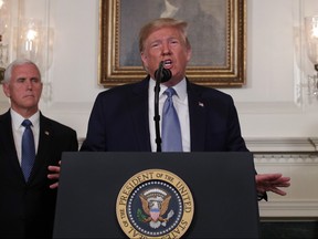 U.S. President Donald Trump makes remarks in the Diplomatic Reception Room of the White House as U.S. Vice President Mike Pence looks on August 5, 2019 in Washington, DC.
