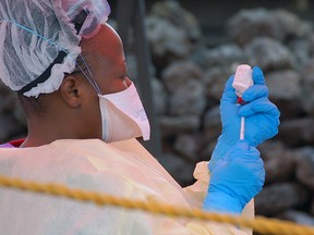 A nurse prepares a vaccine against Ebola in Goma on August 7, 2019. - Three cases of the deadly virus was detected in the border city of Goma, the Congolese presidency said on August 1, 2019.