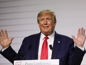 US President Donald Trump gestures during a joint-press conference with French President Emmanuel Macron in Biarritz, south-west France on August 26, 2019, on the third day of the annual G7 Summit attended by the leaders of the world's seven richest democracies, Britain, Canada, France, Germany, Italy, Japan and the United States.
