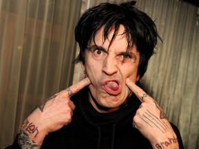 Musician Tommy Lee poses at the after party for the screening of "Waiting for Lightning" at the Roosevelt Hotel on April 10, 2012 in Los Angeles, California.