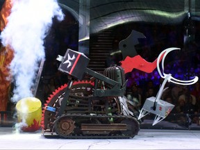 A robot starts a fight during a robot combat contest at the Bronebot show in Moscow on February 21, 2016.