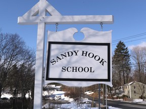 A sign stands near the site of the December 2012 Sandy Hook school shooting on the day of the National School Walkout on March 14, 2018 in Sandy Hook Connecticut.
