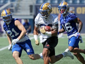 Running back Andrew Harris breaks loose with the ball during Winnipeg Blue Bombers practice on Tuesday, July 23, 2019