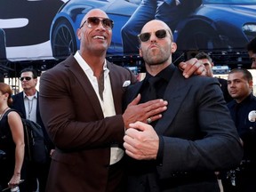 Cast members Dwayne Johnson and Jason Statham arrive at the premiere for "Fast & Furious Presents: Hobbs & Shaw" in Los Angeles, on July 13, 2019.