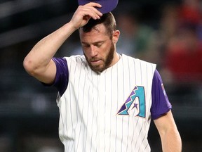 Arizona Diamondbacks pitcher Greg Holland reacts in the ninth inning against the Colorado Rockies at Chase Field.