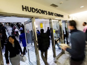 People walk into the Hudson's Bay Company (HBC) flagship department store in Toronto Jan. 27, 2014.