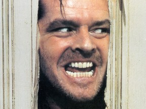 Jack Nicholson peers through a door in lobby card for the film 'The Shining', 1980. (Warner Brothers/Getty Images)