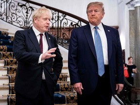 President Donald Trump and British Prime Minister Boris Johnson speak before a working breakfast at the G7 Summit in Biarritz, France on August 25, 2019. (ERIN SCHAFF/AFP/Getty Images)
