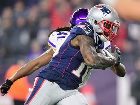 Josh Gordon #10 of the New England Patriots runs on his way to scoring a touchdown during the third quarter against the Minnesota Vikings at Gillette Stadium on December 2, 2018 in Foxborough, Massachusetts. (Photo by Billie Weiss/Getty Images)