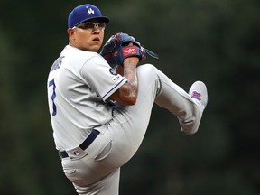 Starting pitcher Julio Urias of the Los Angeles Dodgers throws against the Colorado Rockies at Coors Field on July 30, 2019 in Denver. (Matthew Stockman/Getty Images)