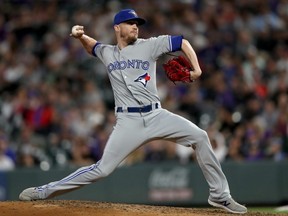 Blue Jays pitcher Ken Giles throws in the eighth inning against the Rockies at Coors Field in Denver on June 1, 2019.