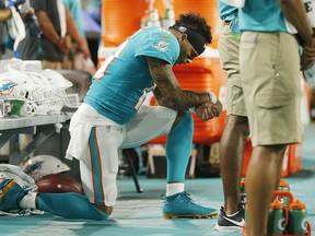 Kenny Stills of the Miami Dolphins kneels during the playing of the national anthem prior to the preseason game against the Jacksonville Jaguars at Hard Rock Stadium on August 22, 2019 in Miami, Florida. (Michael Reaves/Getty Images)