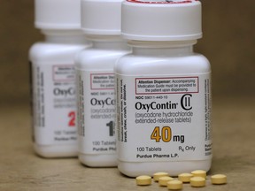 Bottles of prescription painkiller OxyContin pills, made by Purdue Pharma sit on a counter at a local pharmacy in Provo, Utah, U.S., April 25, 2017.    (REUTERS/George Frey)