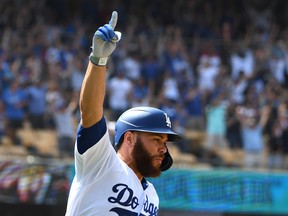 Dodgers catcher Russell Martin, shown celebrating after hitting a two-RBI single for a walk-off win against the St. Louis Cardinals earlier this month, has enjoyed his time L.A. despite a diminished role. (GETTY IMAGES FILE)