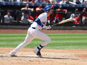 Jeff McNeil of the New York Mets doubles and drives in two runs in the third inning against the Washington Nationals during their game at Citi Field on Aug. 11, 2019 in New York City.