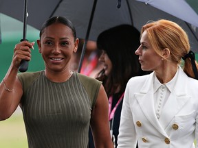 Mel B and Geri Horner walk in the Paddock before the F1 Grand Prix of Great Britain at Silverstone on July 14, 2019, in Northampton, England.