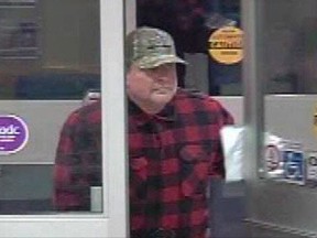 A suspect is shown in a screengrab from video in a handout from the Medicine Hat Police Service Facebook page. A former Winnipeg television news director is facing more bank robbery charges.Regina police charged Stephen Vogelsang on Friday with three separate bank robberies in that city. (THE CANADIAN PRESS/HO-Facebook)