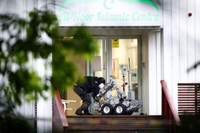 A man operates a police robot near the site of a shooting in al-Noor Islamic centre mosque, near Oslo, Norway, on Saturday, Aug. 10, 2019.
