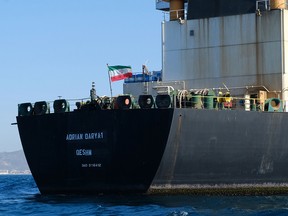 An Iranian flag flutters on board the Adrian Darya oil tanker, formerly known as Grace 1, off the coast of Gibraltar on August 18, 2019. Gibraltar rejected a US demand to seize the Iranian oil tanker at the centre of a diplomatic dispute as it prepared to leave the British overseas territory after weeks of detention. (Johnny BUGEJA / Getty Images)
