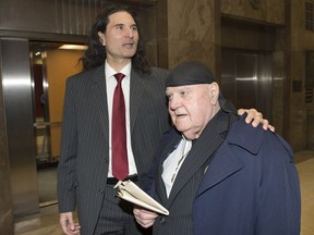 The editor of a hate-filled Toronto-based publication has been jailed for one year. James Sears, left, and LeRoy St. Germaine leave court after being found guilty of promoting hate in Toronto on Thursday, Jan. 24, 2019. St. Germaine, the publisher of the news letter will be sentenced next week.