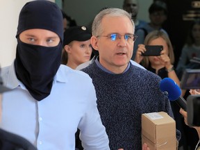 Former U.S. Marine Paul Whelan, who was detained and accused of espionage, is escorted inside a court building in Moscow August 23, 2019. (REUTERS/Tatyana Makeyeva)