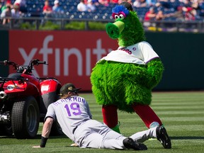 The Phillie Phanatic reacts with Colorado Rockies centre fielder Charlie Blackmon (19) at Citizens Bank Park.  (Bill Streicher-USA TODAY Sports/File Photo)