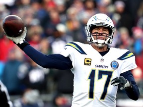 Philip Rivers of the Los Angeles Chargers throws against the New England Patriots at Gillette Stadium on January 13, 2019 in Foxborough, Mass. (Al Bello/Getty Images)