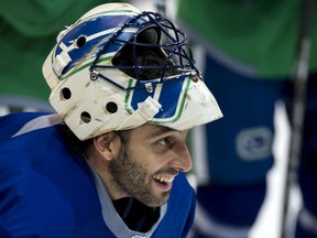 Star goalie Roberto Luongo is all smiles at a Canucks practice in 2013.
