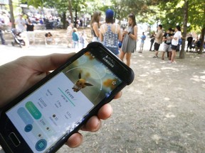A Pokemon Go player loads the game at the Jack Layton ferry terminals in Toronto, August 7, 2016.