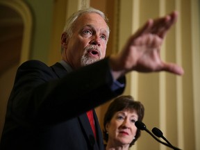 Sen. Ron Johnson (R-WI) (left) speaks as Sen. Susan Collins (R-ME) listens during a news conference December 17, 2015 on Capitol Hill in Washington. (Alex Wong/Getty Images)
