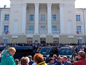 In this grab taken from a footage provided by the Russian State Atomic Energy Corporation ROSATOM press service, people gather for the funerals of five Russian nuclear engineers killed by a rocket explosion in Sarov, the closed city, located 370 kilometers (230 miles) east of Moscow, Monday, Aug. 12, 2019.
