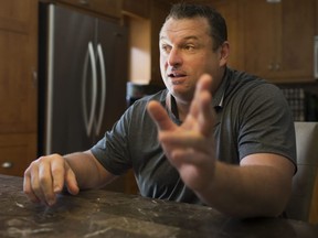 New Ottawa Senators head coach D.J. Smith sits down with Bruce Garrioch in the kitchen of his home in Tecumseh, Ont., on Tuesday. (DAX MELMER/POSTMEDIA NETWORK)