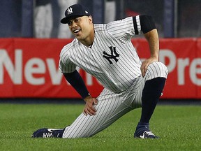 New York Yankees right fielder Giancarlo Stanton (27) stretches prior to the game against the Tampa Bay Rays at Yankee Stadium. (Andy Marlin-USA TODAY Sports)