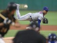 Mets starting pitcher Marcus Stroman delivers against the Pirates during the fourth inning on Saturday night at PNC Park in Pittsburgh. Stroman was making his Mets debut after being traded to New York by the Toronto Blue Jays. He went 4.1 innings, allowing three runs on seven hits while striking out three and walking two.