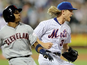 Noah Syndergaard of the New York Mets celebrates after beating Greg Allen of the Cleveland Indians to first base at Citi Field on August 22, 2019 in New York. (Elsa/Getty Images)