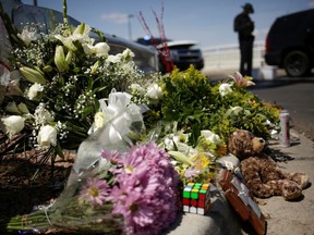 Flowers are seen at the site of a mass shooting where 20 people lost their lives at a Walmart in El Paso, Texas, U.S. August 4, 2019.