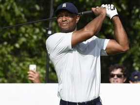 Tiger Woods hits his tee shot on the 17th hole during the first round of The Northern Trust golf tournament at Liberty National Golf Course in Jersey City, N.J., on Thursday, Aug. 8, 2019.