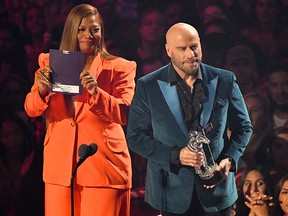 Queen Latifah and John Travolta appear onstage during the 2019 MTV Video Music Awards at Prudential Center on August 26, 2019 in Newark, N.J. (Mike Coppola/Getty Images for MTV)