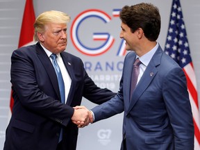 President Donald Trump and Prime Minister Justin Trudeau shake hands as they hold a bilateral meeting during the G7 summit in Biarritz, France, August 25, 2019. (REUTERS/Carlos Barria)