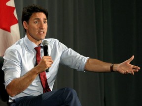 Prime Minister Justin Trudeau answers questions at a Liberal Party fundraising event at the Delta Ocean Pointe Resort in Victoria, B.C., on Thursday, July 18, 2019.