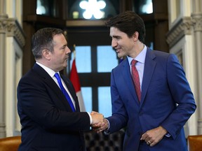 Prime Minister Justin Trudeau, right, shakes hands with Alberta Premier Jason Kenney in his office on Parliament Hill in Ottawa on Thursday, May 2, 2019. (THE CANADIAN PRESS/Sean Kilpatrick)