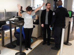 TSA agents check passengers at a security checkpoint at LaGuardia Airport in New York City, January 31, 2019. (REUTERS/Carlo Allegri/File Photo)