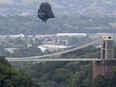 Darth Vader balloon above Clifton Suspension Bridge during the hot air balloons mass ascent at sunrise on the first day of the Bristol International Balloon Fiesta on Aug.8, 2019 in Bristol, England.