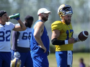 Quarterback Chris Streveler (right) stands with injured quarterback Matt Nichols at Winnipeg Blue Bombers practice on the University of Manitoba campus on Monday.