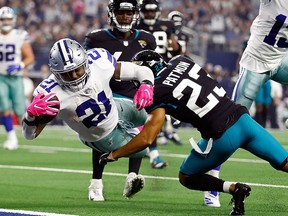 Ezekiel Elliott of the Dallas Cowboys dives into the end zone against Tyler Patmon of the Jacksonville Jaguars at AT&T Stadium on October 14, 2018 in Arlington. (Wesley Hitt/Getty Images)