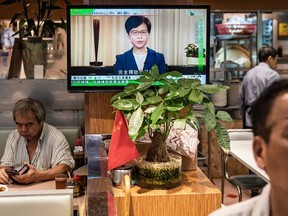 A television replays Hong Kong Chief Executive Carrie Lam announcing the formal withdrawal of the extradition bill inside a restaurant on September 4, 2019 in Hong Kong, China. Hong Kong's embattled leader Carrie Lam announced the formal withdrawal of the controversial extradition bill on Wednesday, meeting one of protesters' five demands after 13 weeks of demonstrations which became the biggest political crisis since Britain handed its onetime colony back to China in 1997.