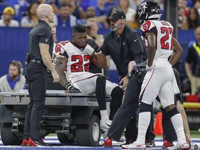Keanu Neal of the Atlanta Falcons sits on a cart after an injury at the end of the first half against the Indianapolis Colts at Lucas Oil Stadium on September 22, 2019 in Indianapolis, Indiana.
